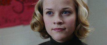 Movie still from “Election” (1999), directed by Alexander Payne – A person with blue eyes; Close Up shot, Low angle