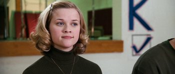 Movie still from “Election” (1999), directed by Alexander Payne – A young woman in a black sweater looks to her left; Close Up shot, Low angle