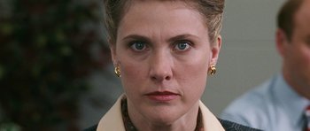 Movie still from “Election” (1999), directed by Alexander Payne – A person wearing a jacket and earrings; Close Up shot, Over the shoulder angle