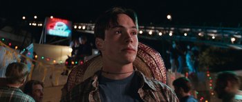 Movie still from “Election” (1999), directed by Alexander Payne – A young man with green hair sitting in a chair; Close Up shot, Low angle