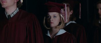 Movie still from “Election” (1999), directed by Alexander Payne – A girl in a graduation cap and gown; Close Up shot, Low angle