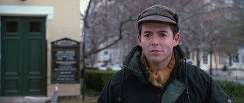 Movie still from “Election” (1999), directed by Alexander Payne – A man wearing a hat and a jacket; Close Up shot, Over the shoulder angle
