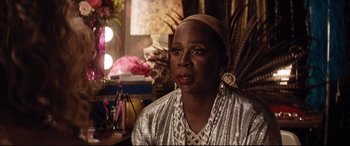 Movie still from “Dumplin'” (2018), directed by Anne Fletcher – An older black woman wearing a head scarf; Close Up shot, Over the shoulder angle