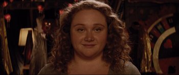 Movie still from “Dumplin'” (2018), directed by Anne Fletcher – A person with curly brown hair; Close Up shot, Over the shoulder angle