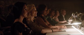Movie still from “Dumplin'” (2018), directed by Anne Fletcher – A group of women sitting at a table in a room; Medium shot, Low angle