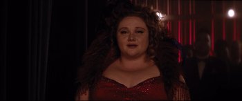 Movie still from “Dumplin'” (2018), directed by Anne Fletcher – A person wearing a red dress; Close Up shot, Over the shoulder angle