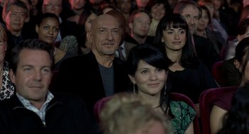 Movie still from “Elegy” (2008), directed by Isabel Coixet – A group of people sitting in front of each other; Close Up shot, High angle