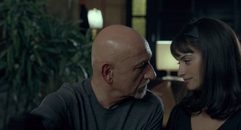 Movie still from “Elegy” (2008), directed by Isabel Coixet – An older man and a younger woman are talking to each other; Close Up shot, Over the shoulder angle