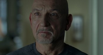 Movie still from “Elegy” (2008), directed by Isabel Coixet – An older man with a bald head and a mustache; Close Up shot, Over the shoulder angle