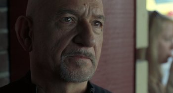 Movie still from “Elegy” (2008), directed by Isabel Coixet – An older man with a beard looking at the camera; Close Up shot, Low angle