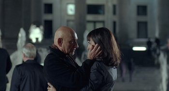 Movie still from “Elegy” (2008), directed by Isabel Coixet – A man and a woman standing next to each other; Close Up shot, Over the shoulder angle