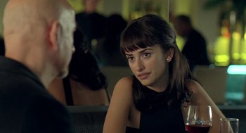 Movie still from “Elegy” (2008), directed by Isabel Coixet – A woman sitting in front of a man in front of a mirror; Close Up shot, Over the shoulder angle