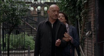 Movie still from “Elegy” (2008), directed by Isabel Coixet – A man and a woman standing next to each other on a sidewalk; Medium shot, Over the shoulder angle