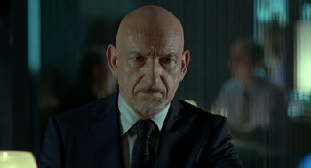 Movie still from “Elegy” (2008), directed by Isabel Coixet – A man with a bald head wearing a suit and tie; Close Up shot, Low angle