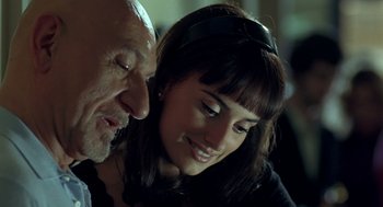 Movie still from “Elegy” (2008), directed by Isabel Coixet – A man and a woman smiling for the camera; Close Up shot, Over the shoulder angle