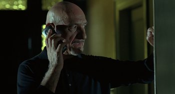 Movie still from “Elegy” (2008), directed by Isabel Coixet – A bald man talking on a cell phone; Close Up shot, Low angle