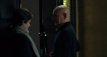 Movie still from “Elegy” (2008), directed by Isabel Coixet – A man and a woman standing next to each other; Medium shot, Over the shoulder angle