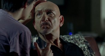 Movie still from “Elegy” (2008), directed by Isabel Coixet – An older bald man is looking at a young woman; Close Up shot, Over the shoulder angle