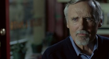 Movie still from “Elegy” (2008), directed by Isabel Coixet – An older man wearing a blue shirt and a blue tie; Close Up shot, Over the shoulder angle