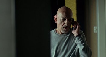 Movie still from “Elegy” (2008), directed by Isabel Coixet – A bald man talking on a cell phone; Close Up shot, Low angle