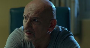 Movie still from “Elegy” (2008), directed by Isabel Coixet – An older man with a shaved head looking at the camera; Close Up shot, Low angle