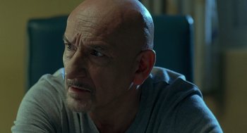 Movie still from “Elegy” (2008), directed by Isabel Coixet – An older man with a bald head looking at the camera; Close Up shot, Over the shoulder angle