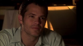 Movie still from “Elektra Luxx” (2010), directed by Sebastian Gutierrez – A person wearing a white shirt; Close Up shot, Over the shoulder angle