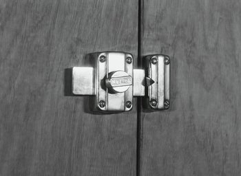 Movie still from “Elevator to the Gallows” (1958), directed by Louis Malle – A lock on a wooden door; Extreme Close Up shot, Overhead angle