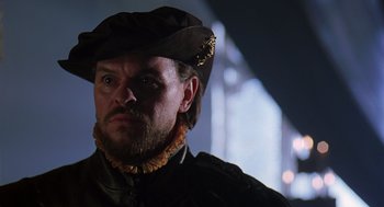 Movie still from “Elizabeth” (1998), directed by Shekhar Kapur – A person wearing a hat; Close Up shot, Over the shoulder angle