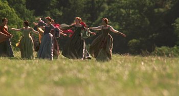 Movie still from “Elizabeth” (1998), directed by Shekhar Kapur – A group of women in medieval costumes dancing in a field; Extreme Wide shot, Low angle