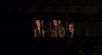 Movie still from “Elizabeth” (1998), directed by Shekhar Kapur – A group of people that are looking through a fence; Close Up shot, Low angle