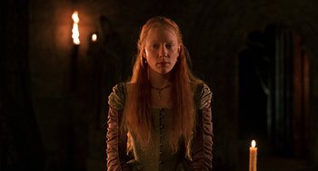 Movie still from “Elizabeth” (1998), directed by Shekhar Kapur – A woman with long red hair wearing a medieval dress; Close Up shot, Low angle