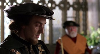 Movie still from “Elizabeth” (1998), directed by Shekhar Kapur – Two men in medieval garb looking at each other; Close Up shot, Over the shoulder angle