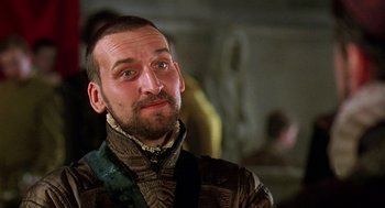 Movie still from “Elizabeth” (1998), directed by Shekhar Kapur – A person with a beard; Close Up shot, Over the shoulder angle