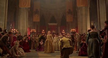 Movie still from “Elizabeth” (1998), directed by Shekhar Kapur – A group of people dressed in medieval clothing; Wide shot, High angle