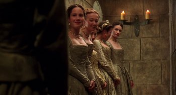Movie still from “Elizabeth” (1998), directed by Shekhar Kapur – A group of women standing next to each other in dresses; Medium shot, Low angle