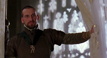 Movie still from “Elizabeth” (1998), directed by Shekhar Kapur – A man in a medieval outfit pointing to the side; Close Up shot, Low angle