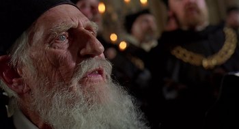 Movie still from “Elizabeth” (1998), directed by Shekhar Kapur – An old man with long white beard looking up; Close Up shot, Low angle