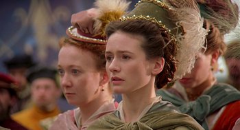 Movie still from “Elizabeth” (1998), directed by Shekhar Kapur – Two women in medieval garb are looking at something; Close Up shot, Over the shoulder angle
