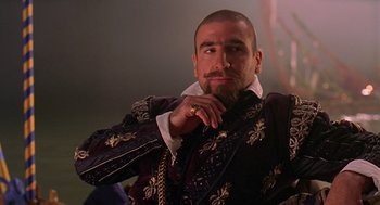 Movie still from “Elizabeth” (1998), directed by Shekhar Kapur – A bearded man in a medieval outfit with a ring; Close Up shot, Low angle