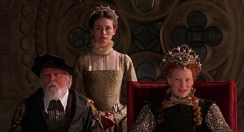 Movie still from “Elizabeth” (1998), directed by Shekhar Kapur – A group of people dressed up in renaissance clothing; Medium shot, Low angle