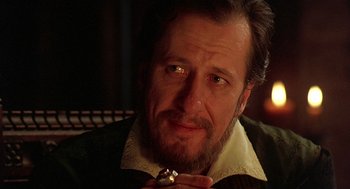 Movie still from “Elizabeth” (1998), directed by Shekhar Kapur – A person with a beard and mustache; Close Up shot, Over the shoulder angle