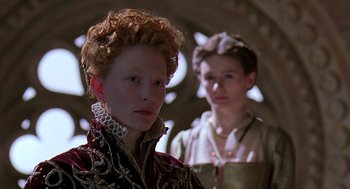 Movie still from “Elizabeth” (1998), directed by Shekhar Kapur – Two young people dressed up in renaissance clothing; Close Up shot, Over the shoulder angle