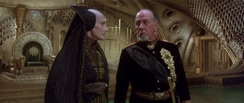 Movie still from “Dune” (1984), directed by David Lynch – A man and a woman dressed up in costumes; Medium shot, Over the shoulder angle