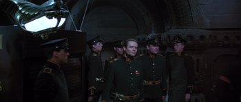 Movie still from “Dune” (1984), directed by David Lynch – A group of men in military uniforms standing next to each other; Medium shot, Low angle