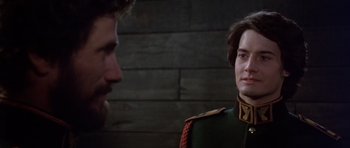 Movie still from “Dune” (1984), directed by David Lynch – A man and a woman in military uniforms talking to each other; Close Up shot, Over the shoulder angle