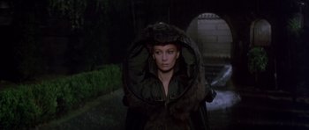 Movie still from “Dune” (1984), directed by David Lynch – A woman in a fur coat and a hat; Medium shot, High angle