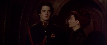 Movie still from “Dune” (1984), directed by David Lynch – A man and a woman in military uniforms; Close Up shot, Over the shoulder angle