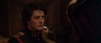 Movie still from “Dune” (1984), directed by David Lynch – A man in a military uniform looking into a mirror; Close Up shot, Over the shoulder angle