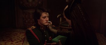 Movie still from “Dune” (1984), directed by David Lynch – A man in a military uniform talking on a phone; Close Up shot, Over the shoulder angle